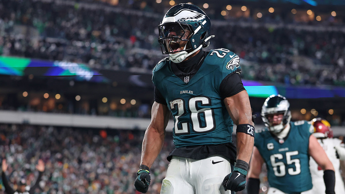 Philadelphia Eagles running back Saquon Barkley (26) celebrates after a touchdown against the Washington Commanders during the second half in the NFC Championship game at Lincoln Financial Field.