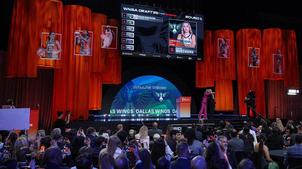 Paige Bueckers is greeted by WNBA commissioner Cathy Engelbert after being selected with the number one overall pick to the Dallas Wings in the 2025 WNBA Draft.