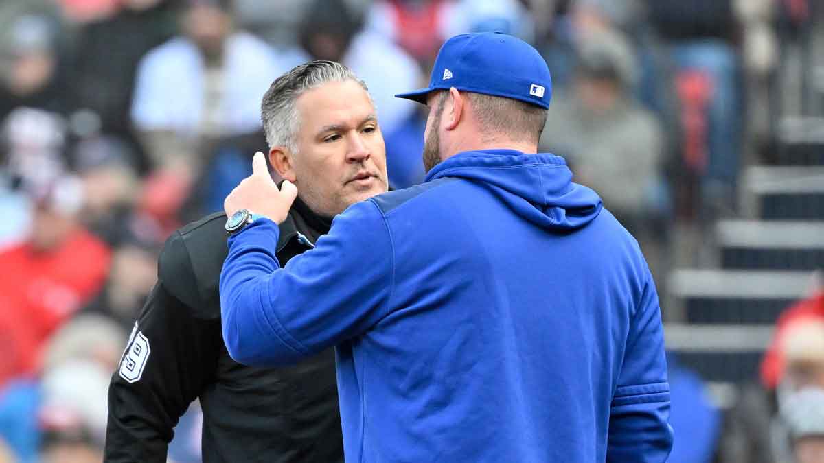 Toronto Blue Jays manager John Schneider (14) speaks to umpire Manny Gonzalez (79) during the second inning against the Boston Red Soxat Fenway Park.