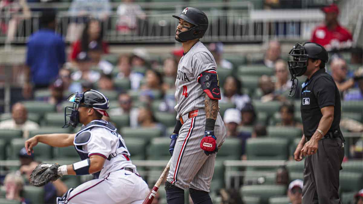 Minnesota Twins shortstop Carlos Correa (4) reacts after being called out on strikes against the Atlanta Braves during the seventh inning at Truist Park.