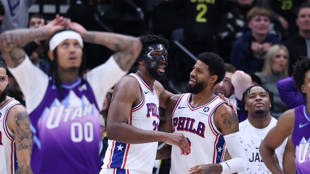 Philadelphia 76ers center Joel Embiid (21) and forward Paul George (8) react to a play against the Utah Jazz during the fourth quarter at Delta Center.