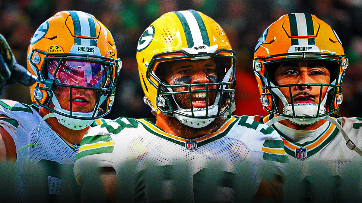 Isaiah McDuffie in the middle, Jordan Love, Lukas Van Ness all around him, Green Bay Packers wallpaper in the background