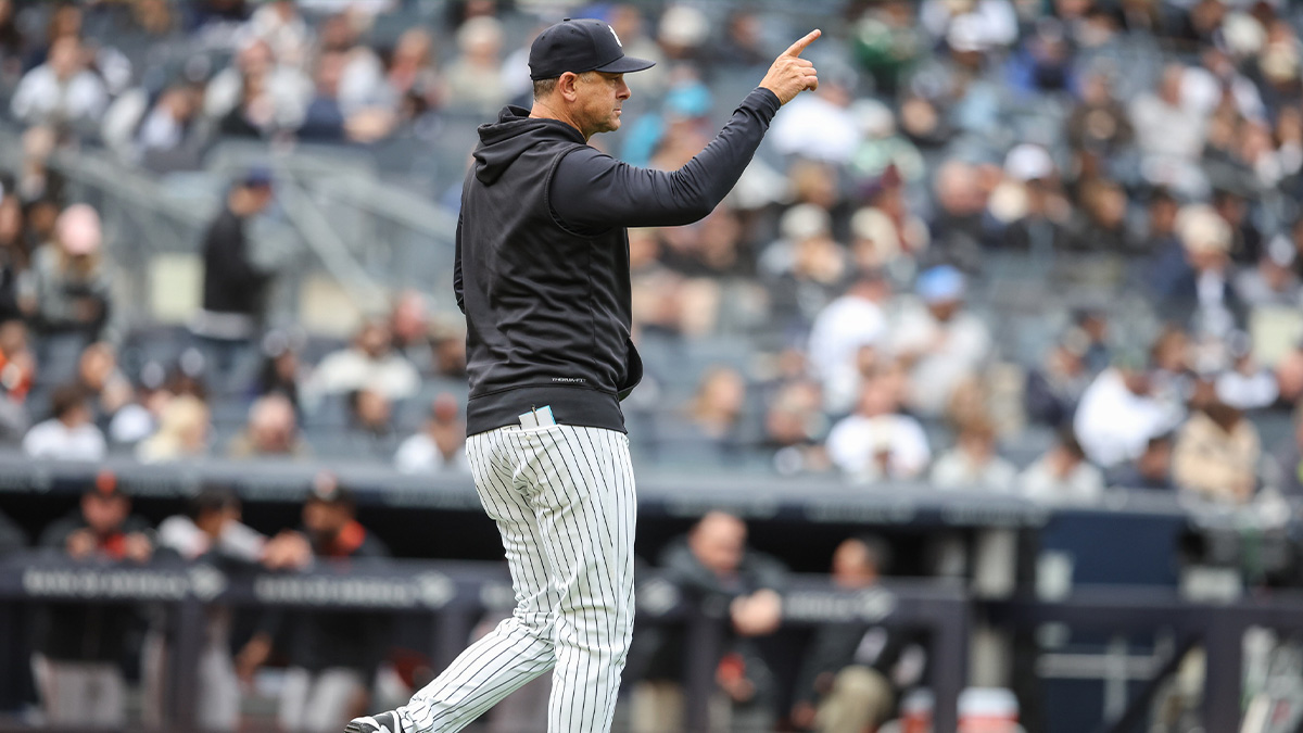 New York Yankees manager Aaron Boone (17) signals for a pitching change in the sixth inning against the San Francisco Giants at Yankee Stadium.