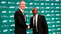 New York Jets General Manager Darren Mougey and Jets Head Coach Aaron Glenn, shake hands as they pose for the press, at the Atlantic Health Jets Training Center,