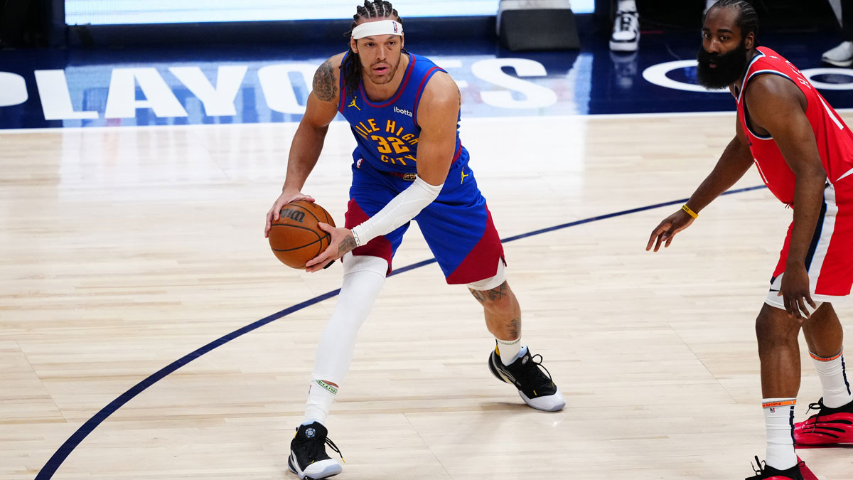 LA Clippers guard James Harden (1) defends on Denver Nuggets forward Aaron Gordon (32) in the first quarter at Ball Arena.