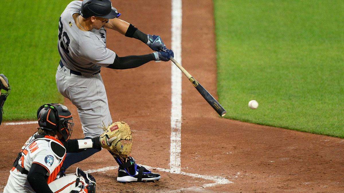 New York Yankees outfielder Aaron Judge (99) hits a single during the fifth inning against the Baltimore Orioles at Oriole Park at Camden Yards.