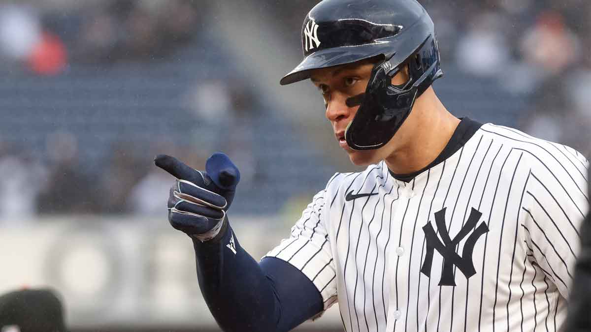 New York Yankees outfielder Aaron Judge (99) reacts after hitting a single against the San Francisco Giants during the fifth inning at Yankee Stadium.