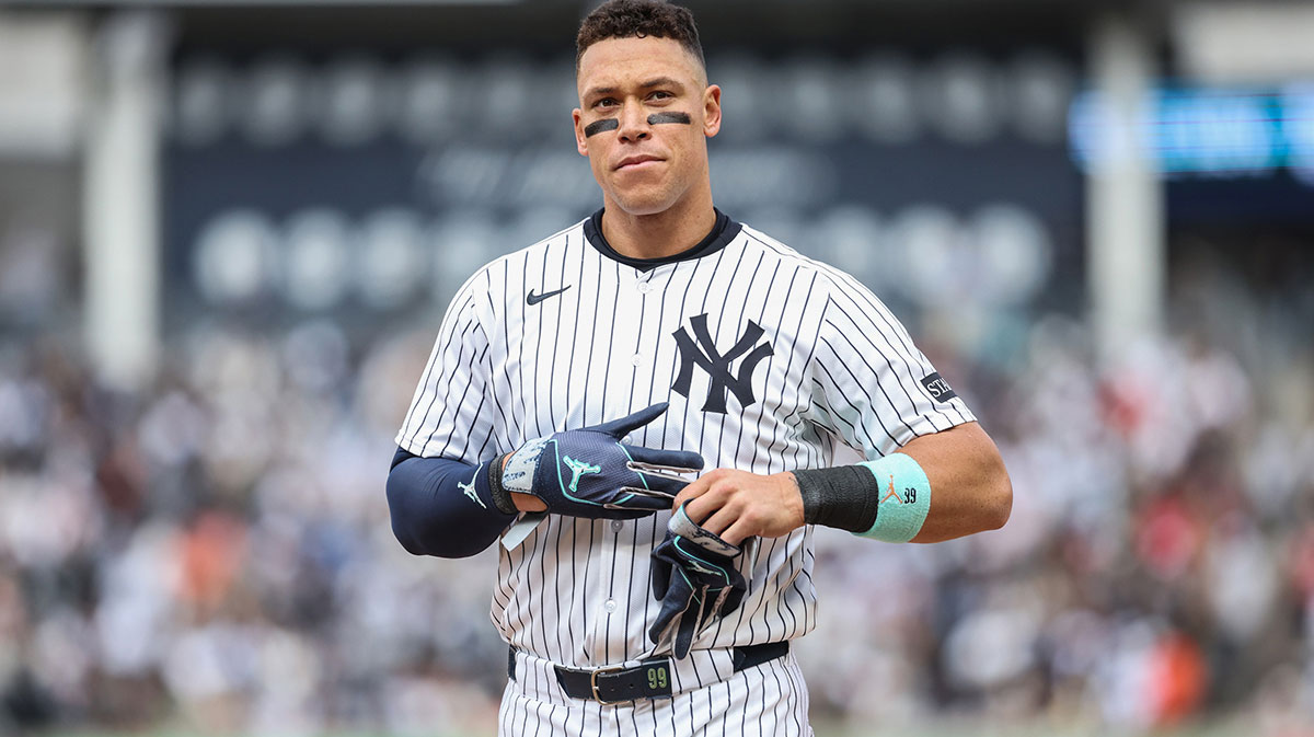 New York Yankees right fielder Aaron Judge (99) heads back to the field after getting stranded on first base in the seventh inning against the San Francisco Giants at Yankee Stadium.