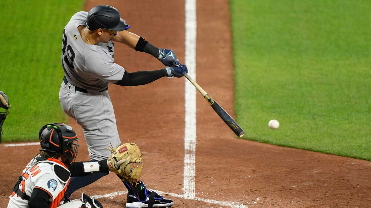 New York Yankees outfielder Aaron Judge (99) hits a single during the fifth inning against the Baltimore Orioles at Oriole Park at Camden Yards.