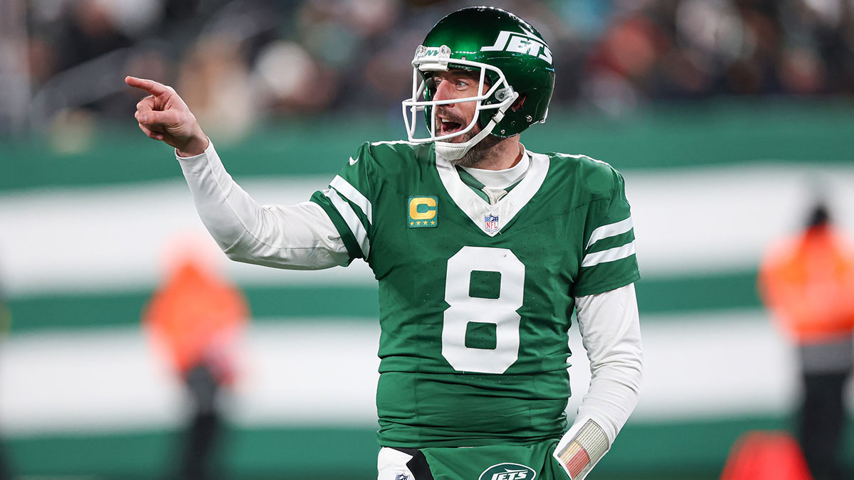 New York Jets quarterback Aaron Rodgers (8) gestures towards the Miami Dolphins bench during the second half at MetLife Stadium.