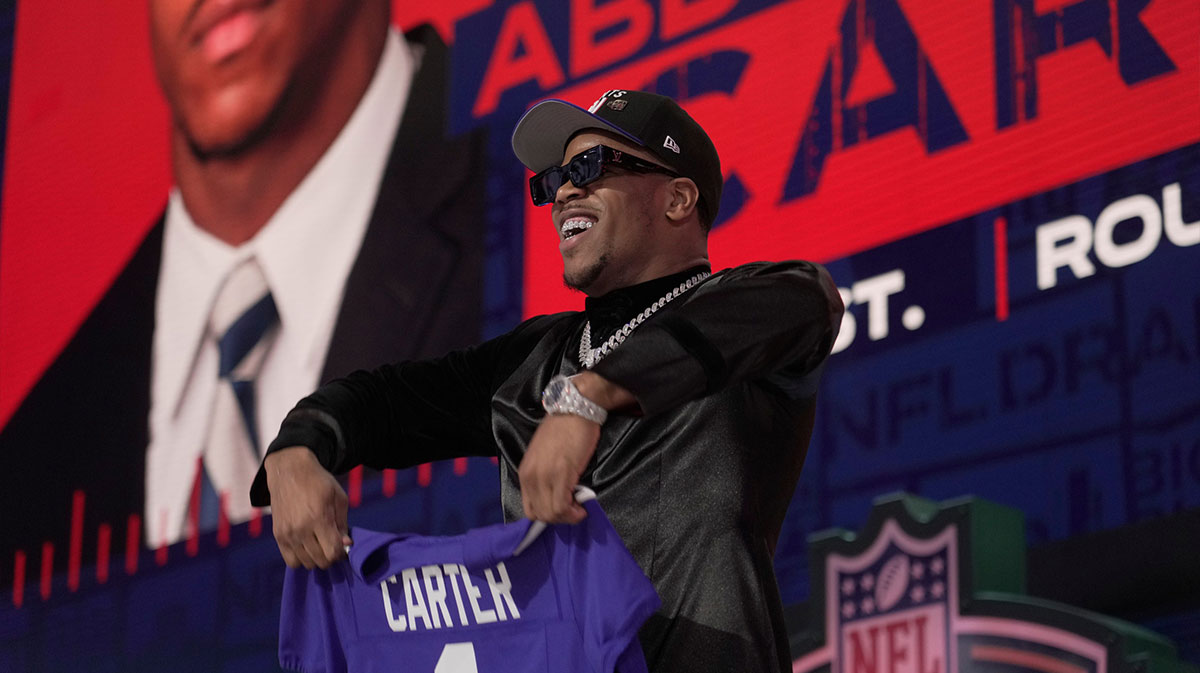 Penn State defensive end Abdul Carter poses after being selected 3rd overall by the New York Giants during the first round of the 2025 NFL Draft at Lambeau Field