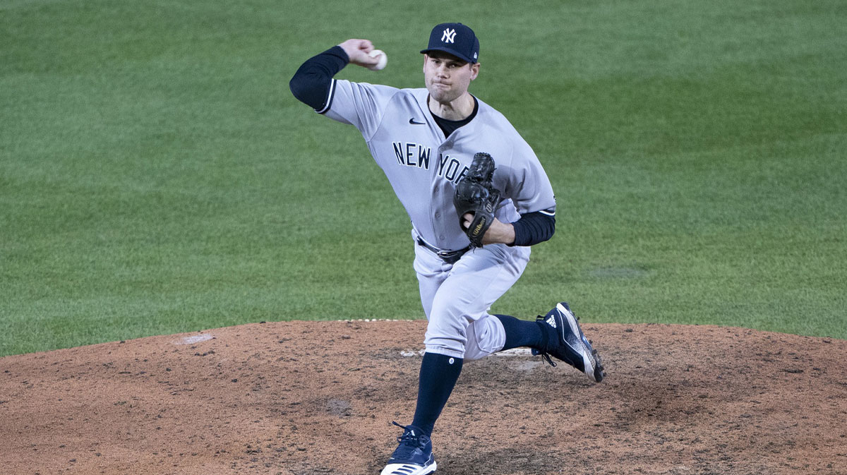 New York Yankees pitcher Adam Ottavino (0) delivers a pitch during the ninth inning against the Toronto Blue Jays at Sahlen Field.