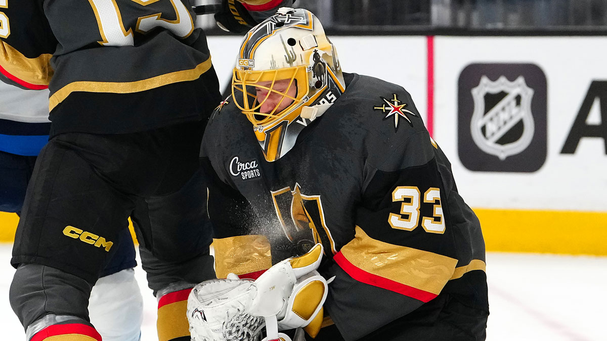 Vegas Golden Knights goaltender Adin Hill (33) makes a save against the Winnipeg Jets during the first period at T-Mobile Arena.
