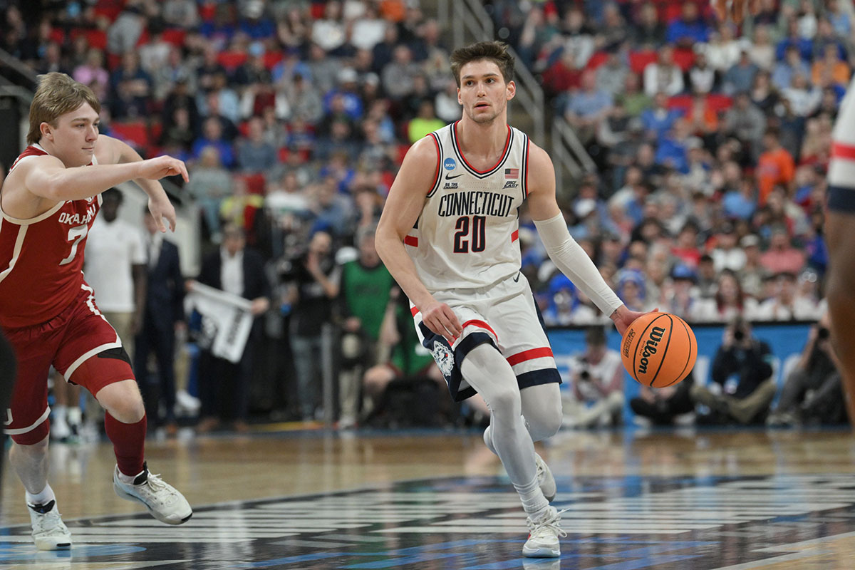 UConn Huskies basketball guard Aidan Mahaney (20) controls the ball during the first half against the Oklahoma Sooners at Lenovo Center.