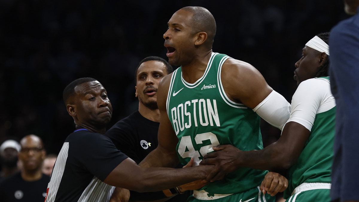 oston Celtics center Al Horford (42) is held back by referee James Williams (60), head coach Joe Mazzulla and guard Jrue Holiday (4) after he was knocked down following a collision with Orlando Magic guard Kentavious Caldwell-Pope (3) during the second quarter of game two of the first round of the 2024 NBA Playoffs at TD Garden.