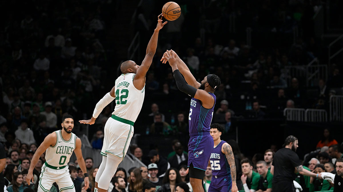 Boston Celtics center Al Horford (42) blocks a shot by Charlotte Hornets forward Josh Okogie (12) during the first half at TD Garden.