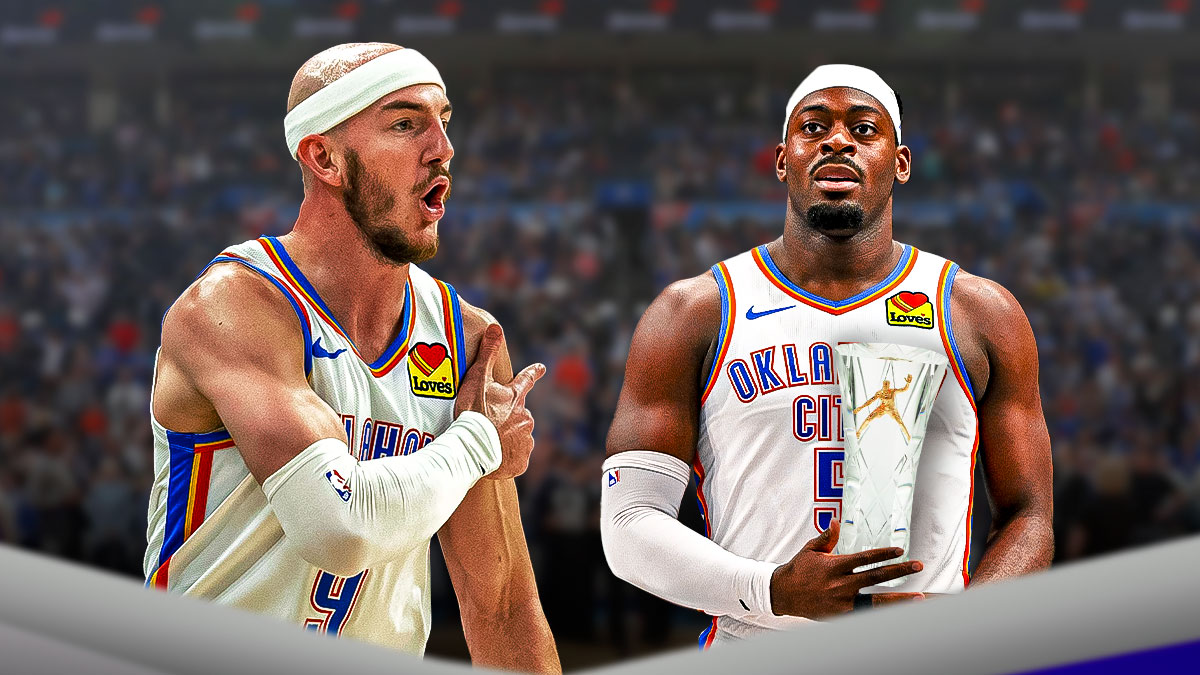 Thunder guard Alex Caruso next to Thunder guard Lu Dort with the Defensive Player of the Year award and Thunder logo in the background
