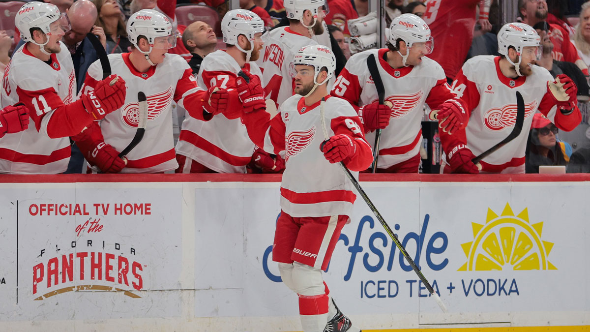 Detroit Red Wings right wing Alex DeBrincat (93) celebrates with teammates after scoring against the Florida Panthers during the first period at Amerant Bank Arena.