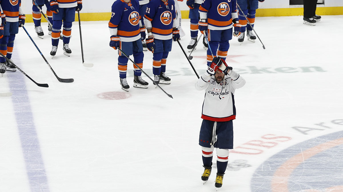 Washington Capitals left wing Alex Ovechkin (8) celebrates after scoring in the during the second period against the New York Islanders at UBS Arena. Ovechkin scored the 895th goal of his career, breaking the NHL all-time career goals record previously held by Wayne Gretzky at UBS Arena.