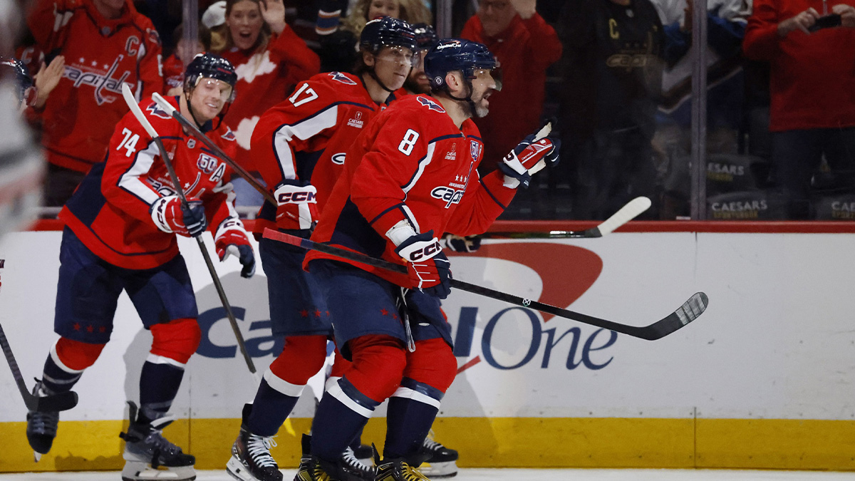 Washington Capitals left wing Alex Ovechkin (8) celebrates with teammates after scoring a goal in the first period against the Chicago Blackhawks at Capital One Arena.