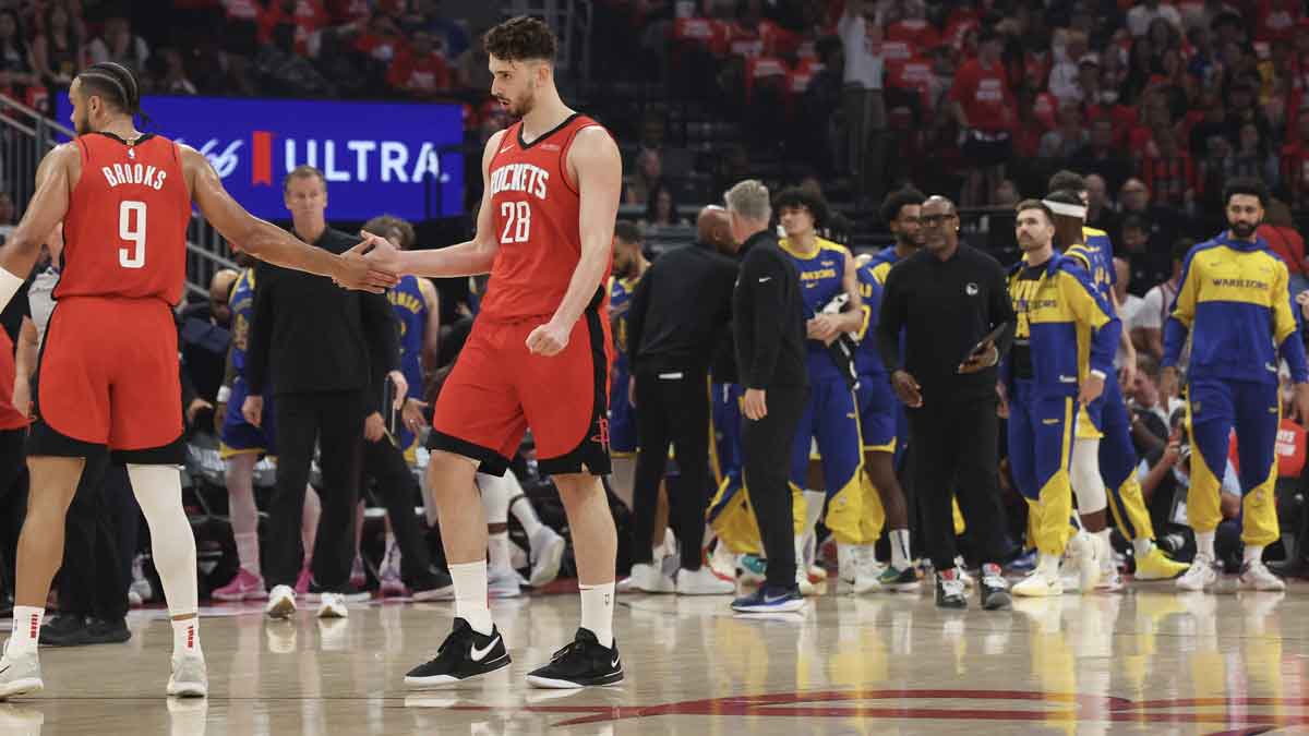 Houston Rockets forward Dillon Brooks (9) celebrates with center Alperen Sengun (28) while Golden State Warriors calls timeout in the first quarter during game five of first round for the 2025 NBA Playoffs at Toyota Center.