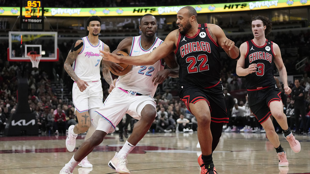 Chicago Bulls forward Talen Horton-Tucker (22) defends Miami Heat forward Andrew Wiggins (22) during the second half at United Center.