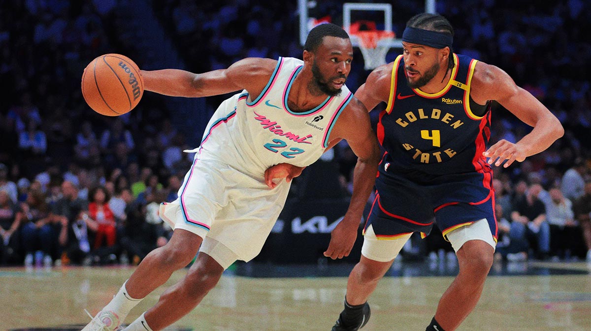 Miami Heat forward Andrew Wiggins (22) drives to the basket against Golden State Warriors guard Moses Moody (4) during the third quarter at Kaseya Center.