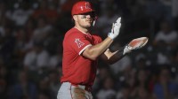 Los Angeles Angels right fielder Mike Trout (27) claps after a play during the first inning against the Houston Astros at Daikin Park.