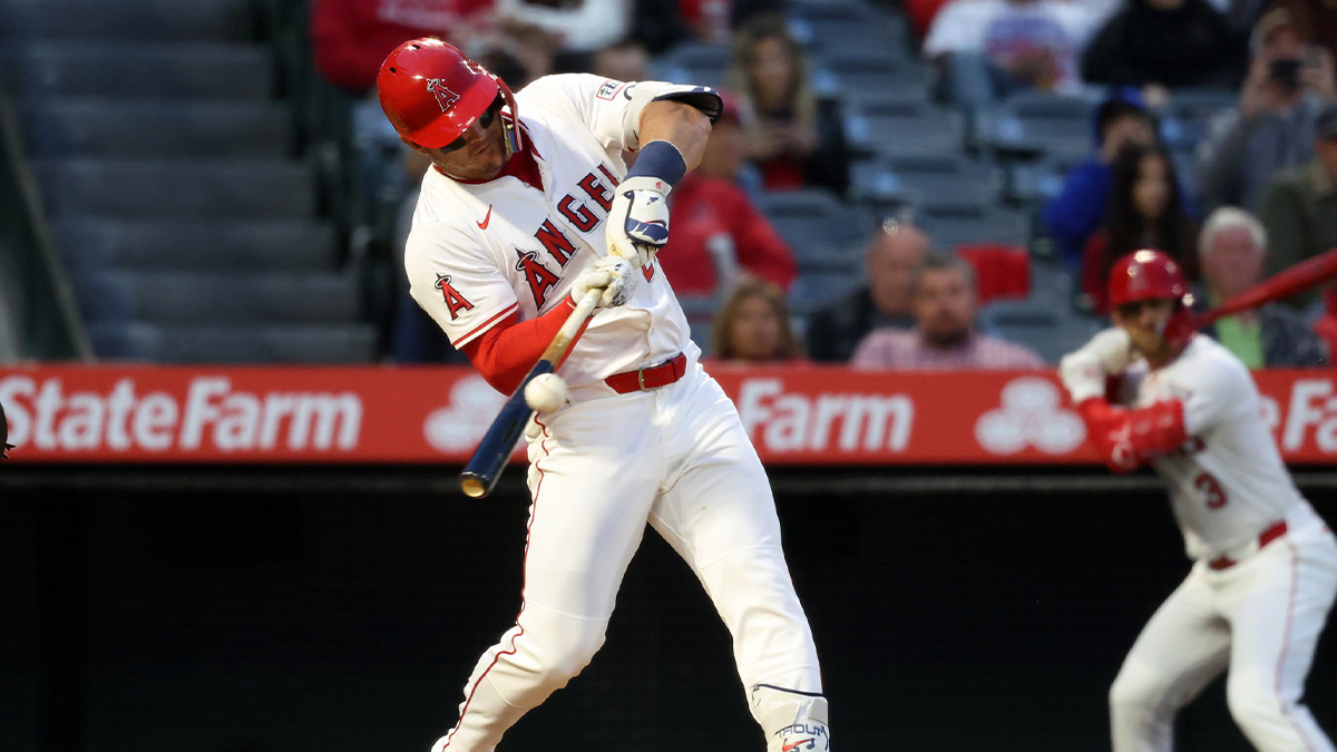Los Angeles Angels right fielder Mike Trout (27) hits a triple during the fourth inning against the Pittsburgh Pirates at Angel Stadium.
