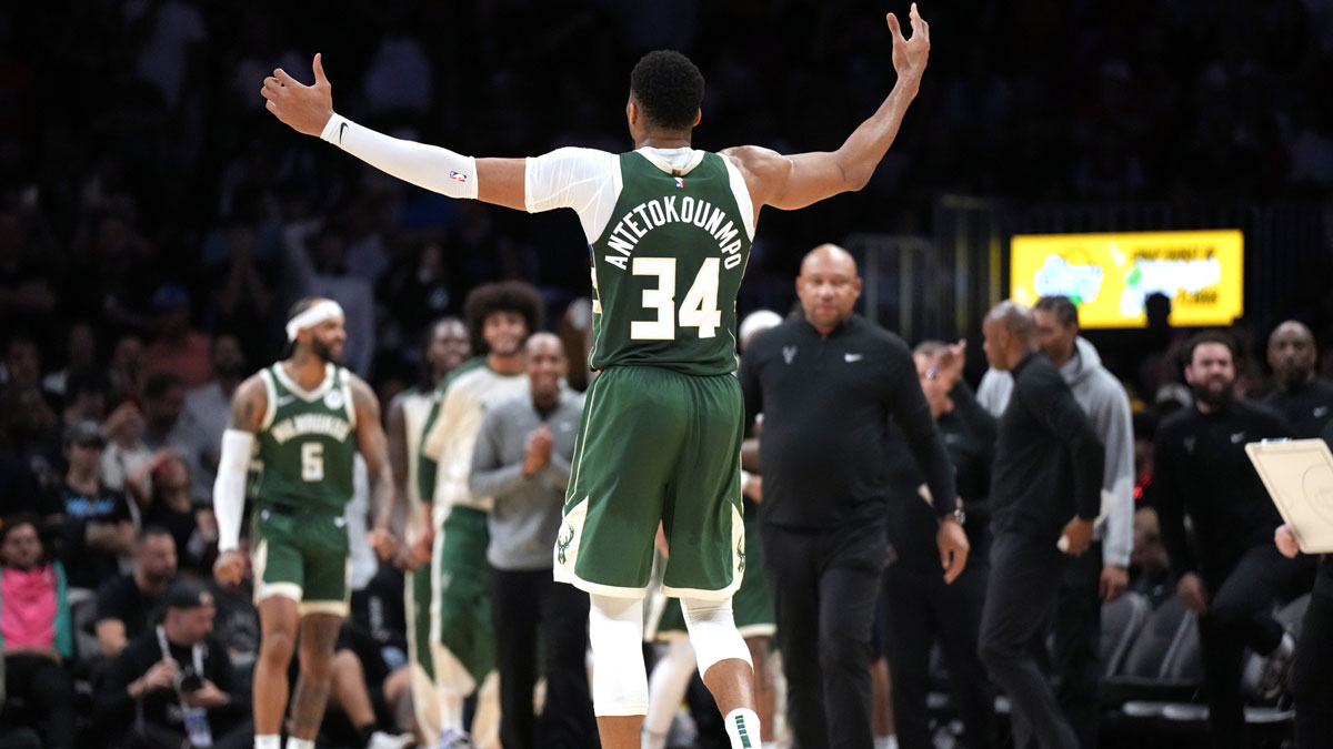 Milwaukee Bucks forward Giannis Antetokounmpo (34) celebrates extending the lead against the Miami Heat in overtime at Kaseya Center.