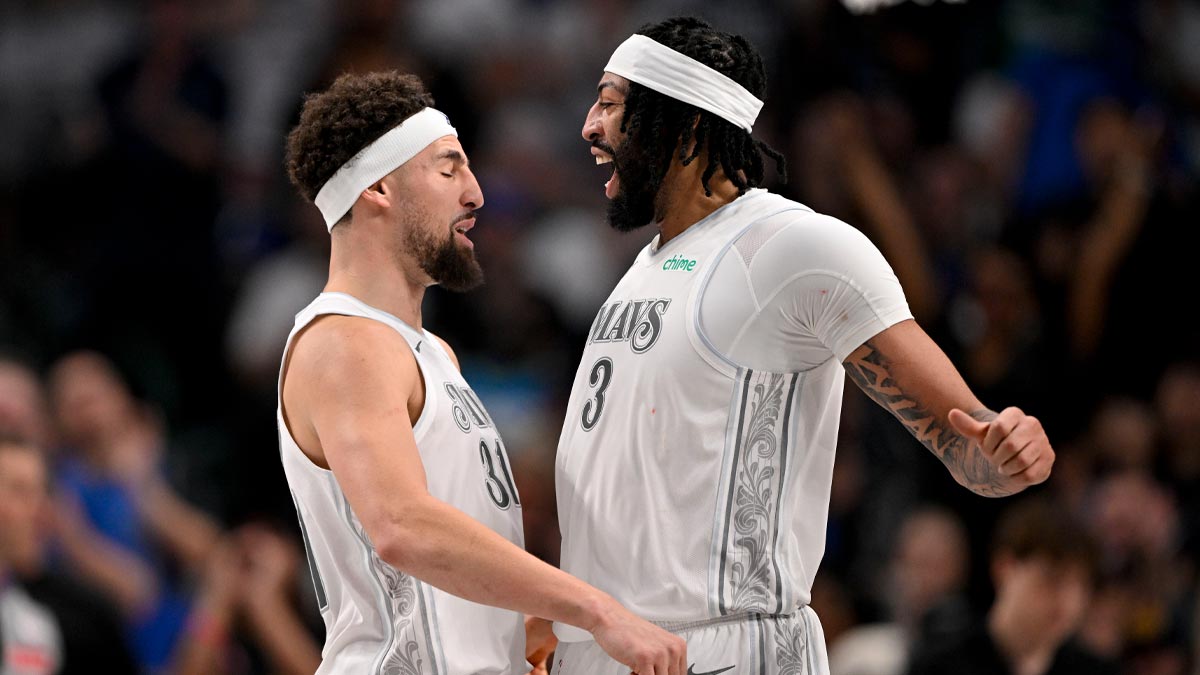 Dallas Mavericks forward Anthony Davis (3) and guard Klay Thompson (31) celebrates after Davis dunks the ball during the second quarter against the Houston Rockets at American Airlines Center.