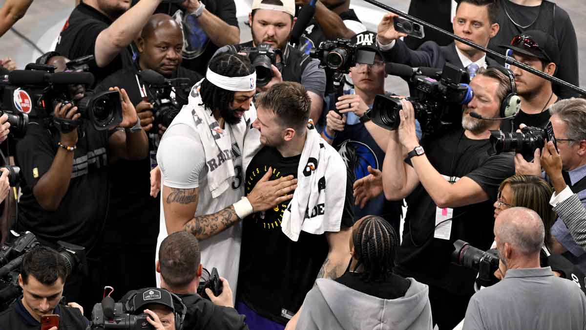 Dallas Mavericks forward Anthony Davis (3) talks with Los Angeles Lakers guard Luka Doncic (77) after the game at the American Airlines Center.