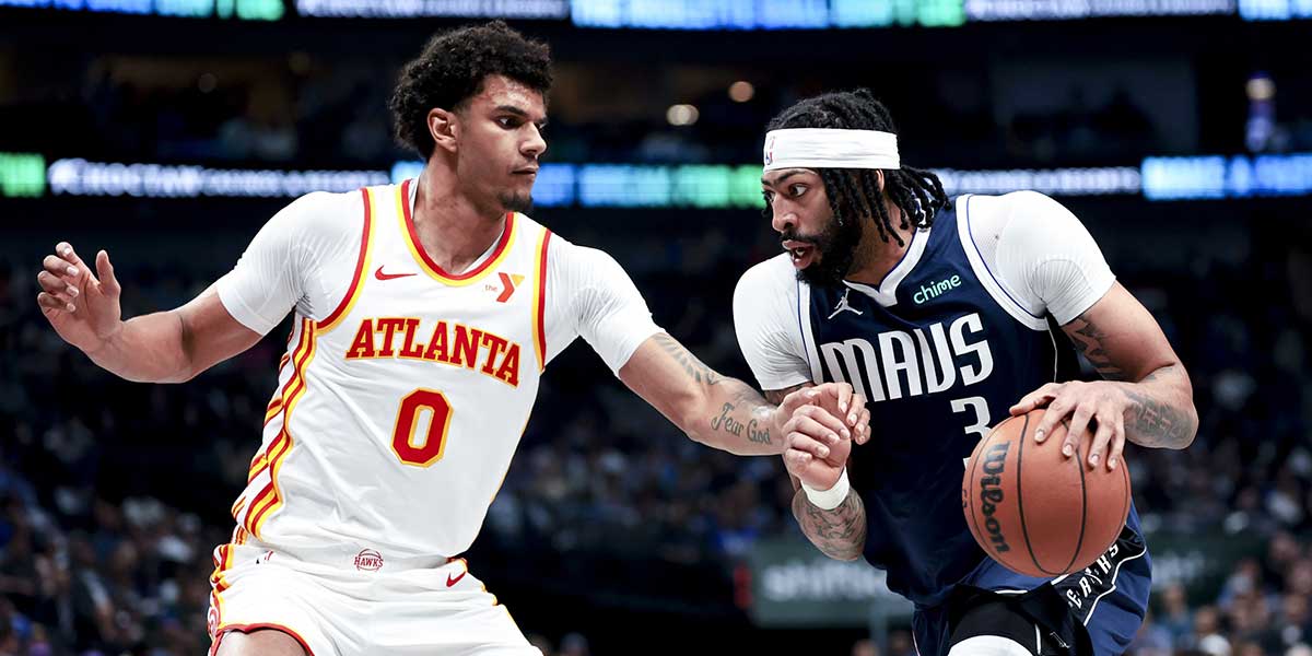 Dallas Mavericks forward Anthony Davis (3) drives to the basket as Atlanta Hawks forward Dominick Barlow (0) defends during the first half at American Airlines Center.