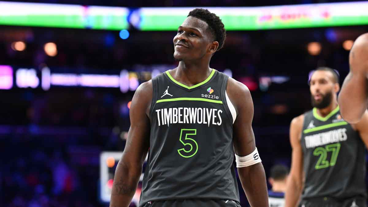 Minnesota Timberwolves guard Anthony Edwards (5) reacts after scoring against the Philadelphia 76ers in the fourth quarter at Wells Fargo Center.