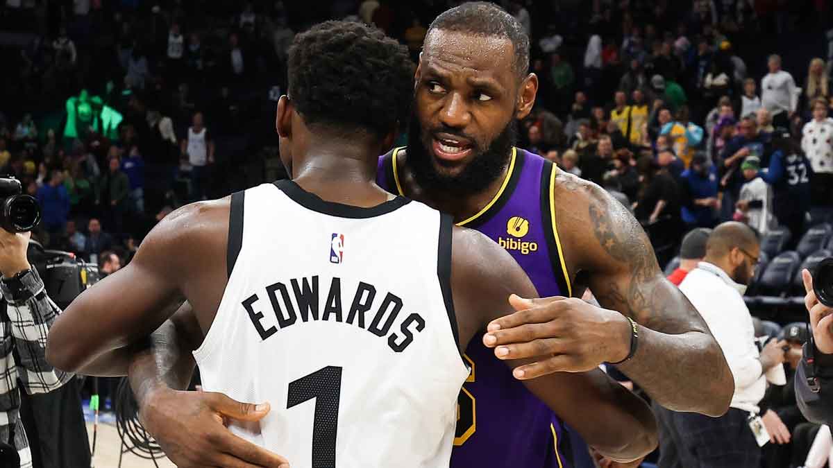 Minnesota Timberwolves guard Anthony Edwards (1) and Los Angeles Lakers forward LeBron James (6) hug after the game at Target Center.
