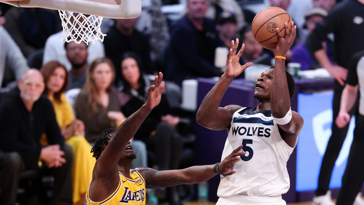Minnesota Timberwolves guard Anthony Edwards (5) goes to the basket against Los Angeles Lakers forward Dorian Finney-Smith (17) during the first quarter of game two of first round for the 2024 NBA Playoffs at Crypto.com Arena.