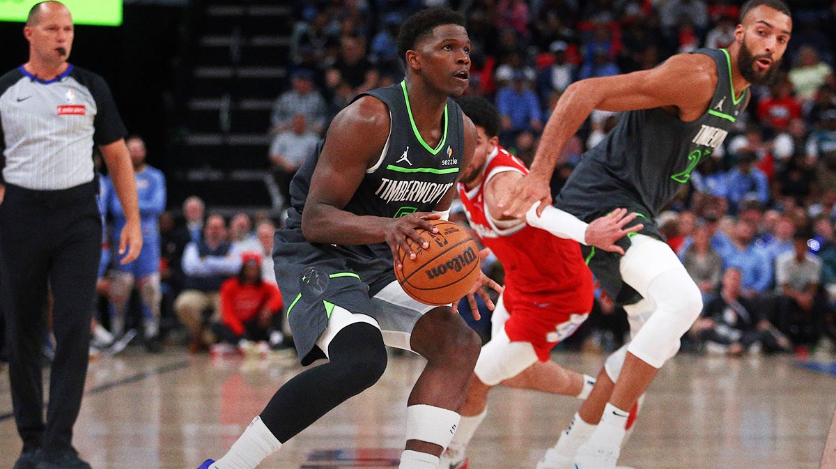 Minnesota Timberwolves guard Anthony Edwards (5) dribbles around a screen set by center Rudy Gobert (27) on Memphis Grizzlies guard Scotty Pippen Jr. (1) during the fourth quarter at FedExForum.