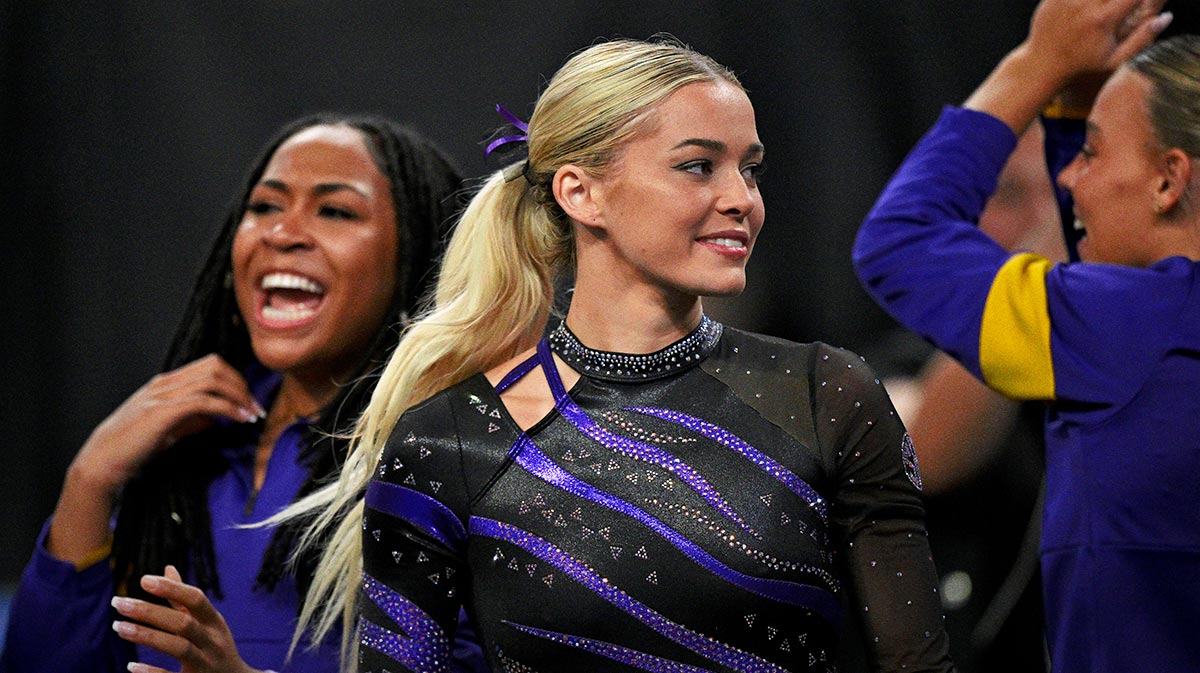 Apr 17, 2025; Fort Worth, TX, USA; LSU Tigers gymnast Olivia Dunne cheers for the Tigers during the 2025 Women's National Gymnastics Semifinal at Dickies Arena. Mandatory Credit: Jerome Miron-Imagn Images