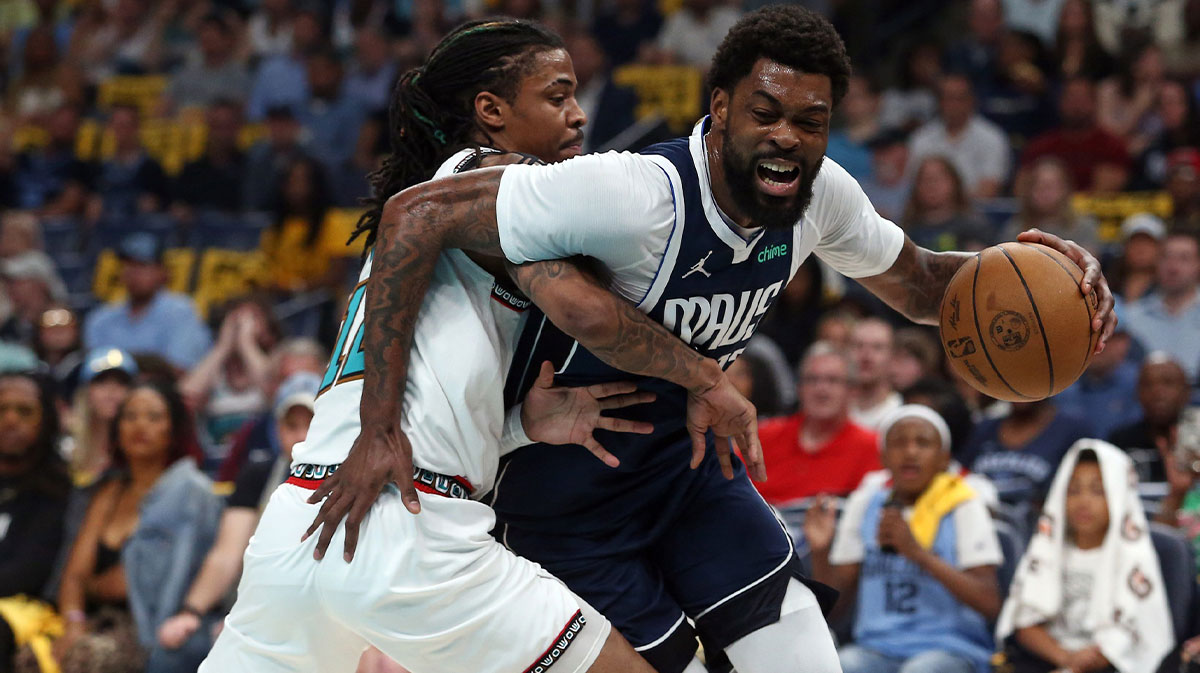 Dallas Mavericks forward Naji Marshall (13) drives to the basket against Memphis Grizzlies guard Ja Morant (12) during the first quarter at FedExForum.