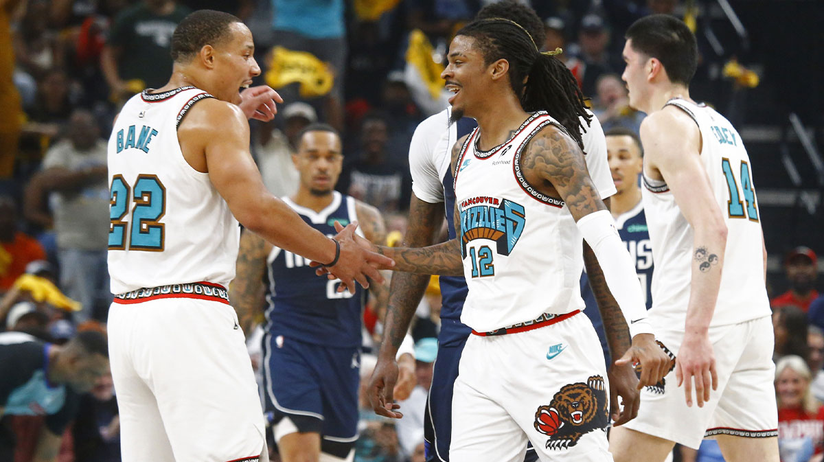 Memphis Grizzlies guard Ja Morant (12) reacts with guard Desmond Bane (22) during the first quarter against the Dallas Mavericks at FedExForum.