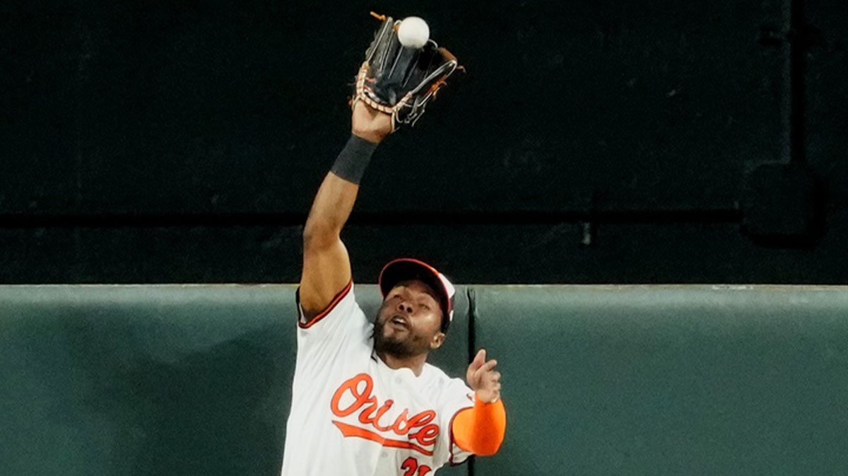 Baltimore Orioles outfielder Cedric Mullins (31) leaps to make a catch during the fifth inning against the New York Yankees at Oriole Park at Camden Yards.