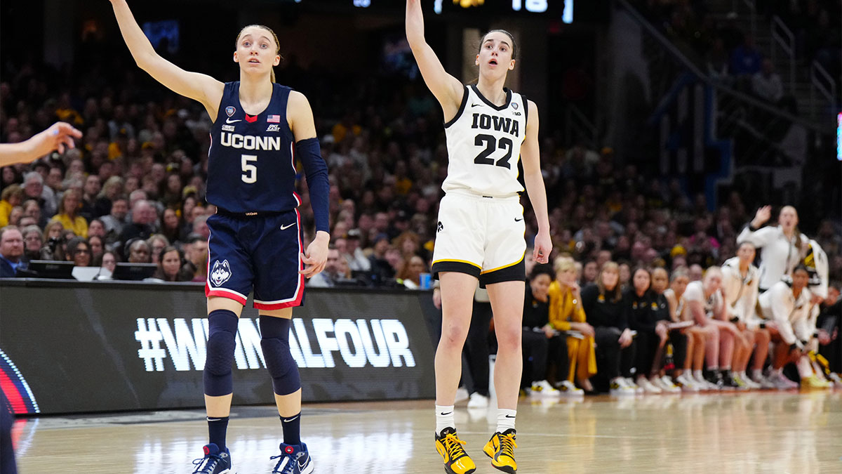 Apr 5, 2024; Cleveland, OH, USA; Iowa Hawkeyes guard Caitlin Clark (22) and Connecticut Huskies guard Paige Bueckers (5) react in the second quarter in the semifinals of the Final Four of the womens 2024 NCAA Tournament at Rocket Mortgage FieldHouse. Mandatory Credit: Kirby Lee-Imagn Images