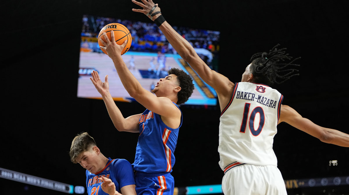 Florida Gators guard Walter Clayton Jr. (1) shoots the ball against Auburn Tigers guard Chad Baker-Mazara (10) during the second half in the semifinals of the men's Final Four of the 2025 NCAA Tournament at the Alamodome.