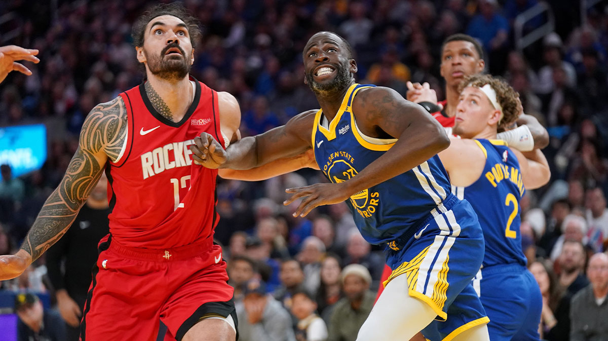 Golden State Warriors forward Draymond Green (23) battles for position with Houston Rockets center Steven Adams (12) in the fourth quarter at the Chase Center.