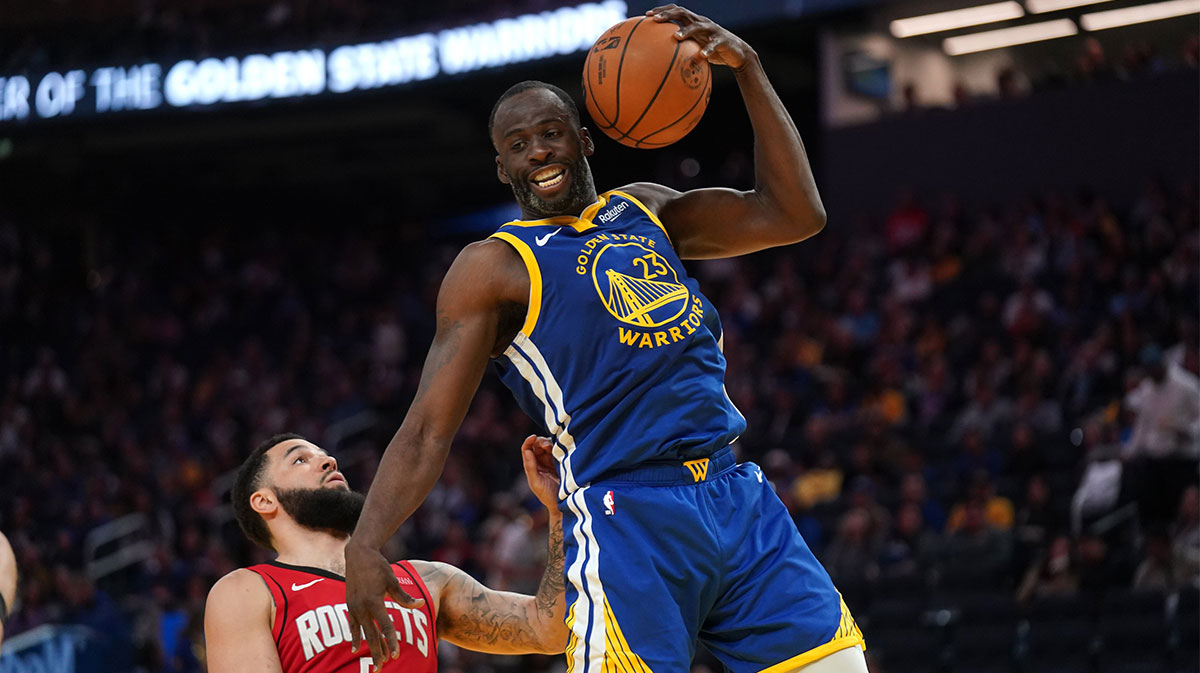 Golden State Warriors forward Draymond Green (23) holds onto a rebound in front of Houston Rockets guard Fred VanVleet (5) in the third quarter at the Chase Center.