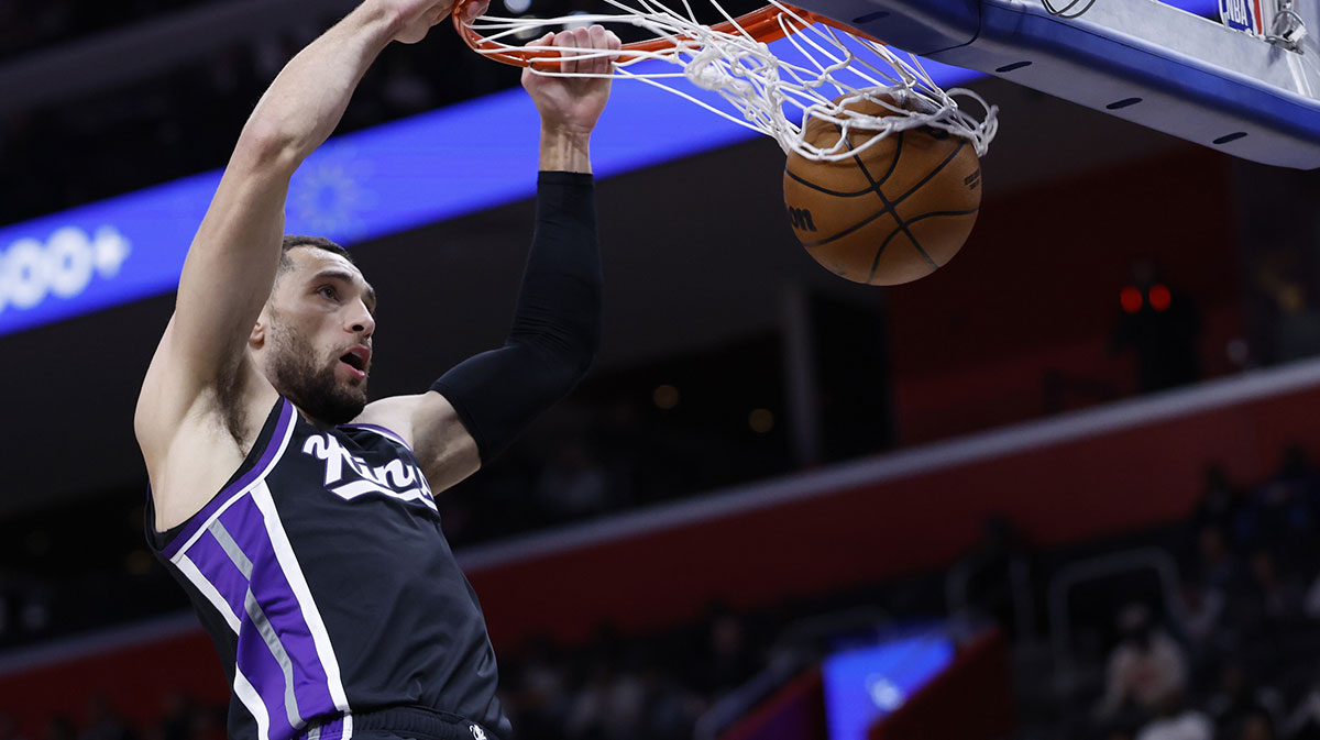 Apr 7, 2025; Detroit, Michigan, USA; Sacramento Kings guard Zach LaVine (8) dunks in the first half against the Detroit Pistons at Little Caesars Arena. Mandatory Credit: Rick Osentoski-Imagn Images