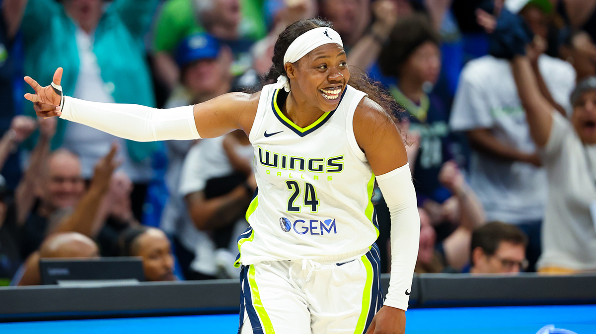 Dallas Wings guard Arike Ogunbowale (24) reacts after scoring during the fourth quarter against the Chicago Sky at College Park Center.