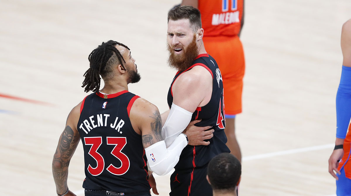 Toronto Raptors guard Gary Trent Jr. (33) talks to center Aron Baynes (46) reacts to an officials call against him during the second half against the Oklahoma City Thunder at Chesapeake Energy Arena.