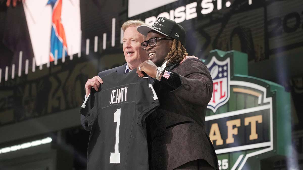 NFL Commissioner Rodger Goodell, left, with Boise State Broncos running back Ashton Jeanty is selected by the Las Vegas Raiders as the number six pick in the first round of the 2025 NFL Draft at Lambeau Field.