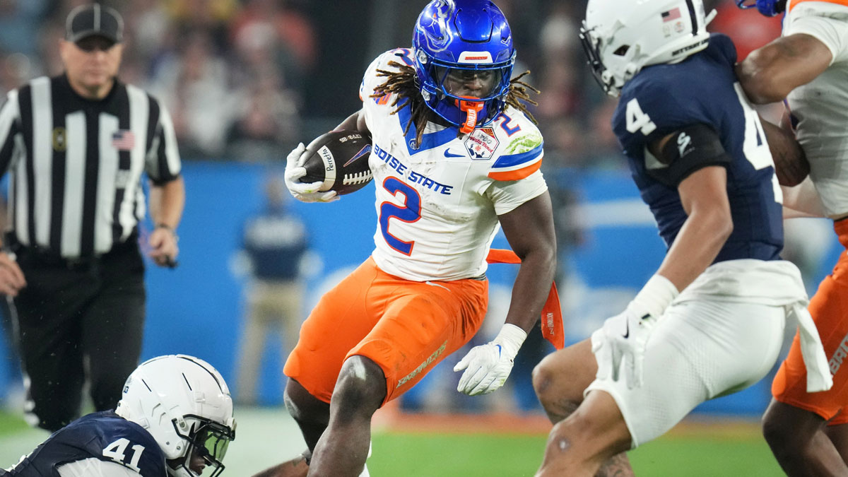 LAS VEGAS RAIDERS: Boise State Broncos running back Ashton Jeanty (2) runs past Penn State Nittany Lions linebacker Kobe King (41) during their Vrbo Fiesta Bowl matchup at State Farm Stadium on Dec. 31, 2024.